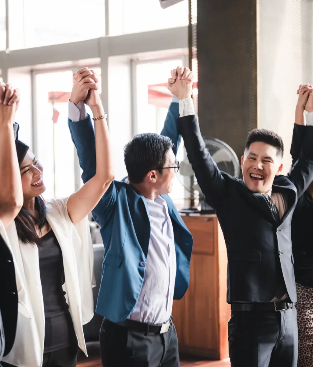 large-business-team-showing-unity-with-their-hands-together-business-team-celebrating.jpg